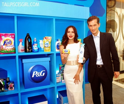 Daphne Iking and Nicholas de La Giroday poses with their favorite P&G product