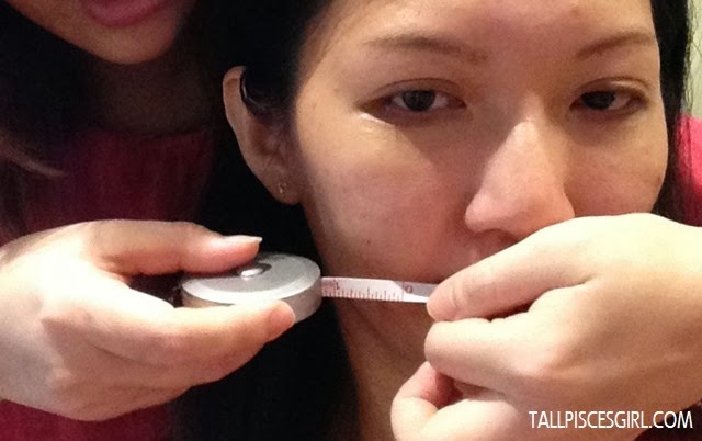 Measuring the width of my left face before applying Miracle-Lift Facial Firming Lotion