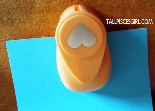 Punch a hole with the heart shape craft puncher