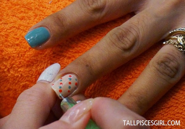 Step 4: Pick contrasting color and dot them on your nails
