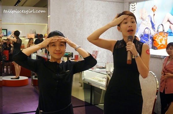 Sothys' staffs teaching us facial exercises