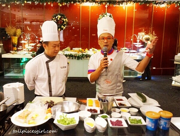 Berjaya Times Square Hotel chef demonstrating with Hideaki Lim, Malaysian futuristic fashion designer