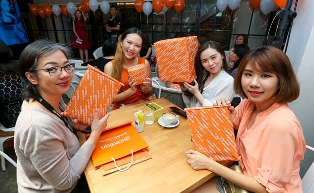 Showing off the gift sets we received from Santa at the launch event